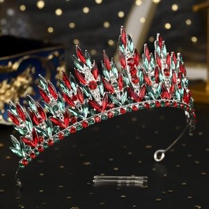 Detail of luxury Christmas crown with red and green rhinestones and matching hair clips