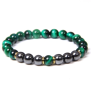 Detail of 8mm green tiger eye beads and hematite stones on a beaded bracelet