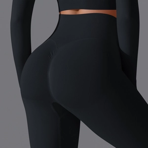 Detail of high waisted seamless black yoga pants with scrunch butt lifting texture