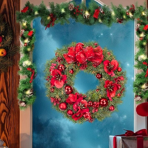 Detailed close-up of a festive Christmas wreath with red flowers and green pine needles