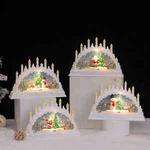 Group of four white Christmas lantern decorations with Santa and reindeer scene
