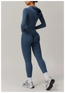 Detail view of scrunch butt yoga leggings and hooded zip jacket in dark blue grey