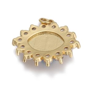 Detailed view of a golden sunburst pendant set with sparkling white cubic zirconia