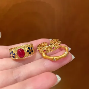 Detail of vintage bamboo style ring set with gold plating and colorful enamel accents
