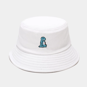 Close-up of high-quality white cotton bucket hat featuring blue dinosaur embroidery detail