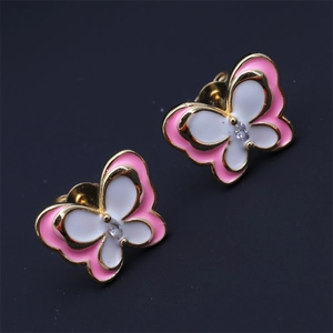 Detailed view of pink and white enamel butterfly earrings with a sparkling crystal center