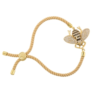 Adjustable woven golden bracelet featuring a detailed bee charm with white and black zircons