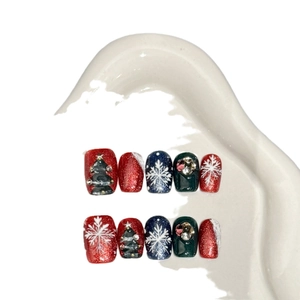 Handmade Christmas press-on nails with festive 3D trees, snowflakes and colorful rhinestones