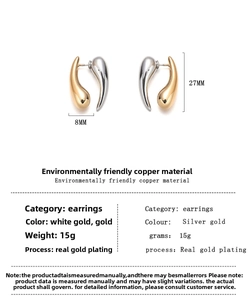 Detail showing two-tone gold and silver teardrop earrings with 27mm height and 8mm width