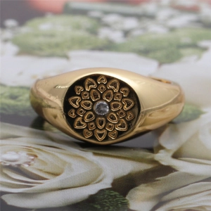 Detailed view of adjustable golden lotus ring featuring a central white zircon stone