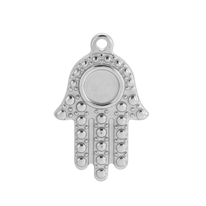 Polished stainless steel Hamsa Hand pendant with embossed dotted patterns on white background