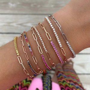 Stack of gold and silver paperclip bracelets with colorful zircon tennis chains for women