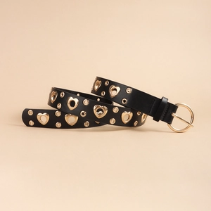 Detail of black leather belt with golden heart-shaped and round metal eyelets