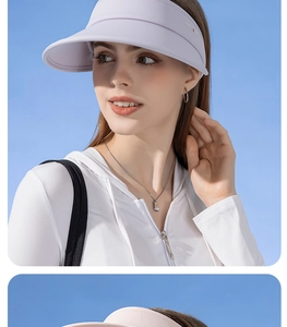 Detail of lavender empty top sun hat with white UV protection jacket against blue sky