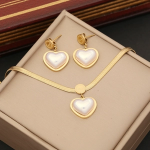 Elegant gold heart jewelry set featuring a flat snake chain necklace and stud earrings