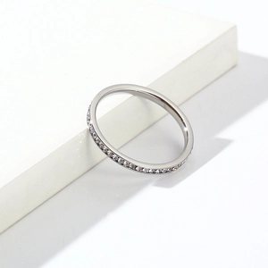 Minimalist silver stainless steel thin band ring with a full circle of pavé crystals