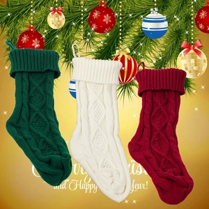 Detailed knit patterns of burgundy, cream, and green Christmas stockings with hanging loops