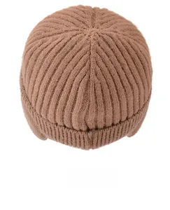 Top view detail of dark brown knit beanie showing thick ribbed texture and circular crown
