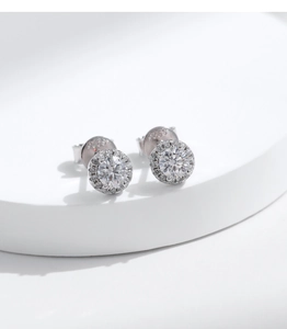 Macro detail of S925 silver halo stud earrings with round moissanite and pave setting