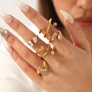 Detail of 18K gold plated stainless steel rings set with sparkling zircon stones