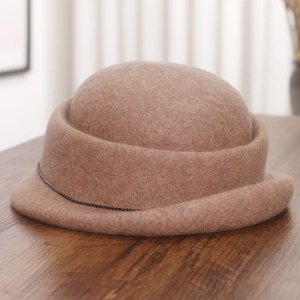 Detail of coffee wool fedora hat featuring a rolled brim and elegant black bead chain decor