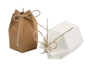 Detailed view of hexagonal kraft paper gift boxes in brown and white with twine ties