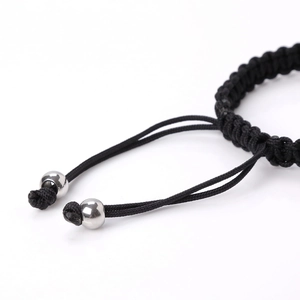Handwoven black rope bracelet with polished stainless steel plate and adjustable silver beads
