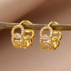 Macro view of 18k gold plated link earrings with micro-pave white cubic zirconia