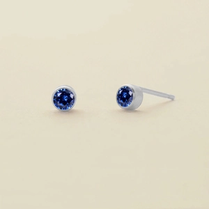 Silver stainless steel stud earrings with round deep blue zircon birthstone inlays