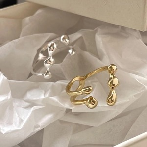 Irregular lava style S925 silver open rings in gold and silver finish on white tissue