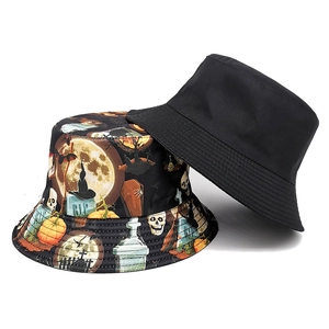 Reversible Halloween bucket hat with spooky cartoon print and plain black side for sun protection