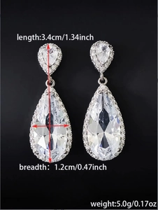 Detailed view of silver teardrop earrings with precise size measurements in inches