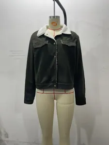 Detailed view of women corduroy jacket featuring white faux shearling collar and pockets