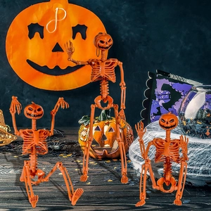 Three posable Halloween skeletons with pumpkin heads for festive party decorations