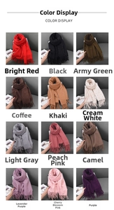 Detailed grid showing 12 colors of knitted scarves with tassels and rhinestone dots