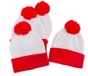 Close-up of red and white striped knitted beanie with a soft pompom and clear texture