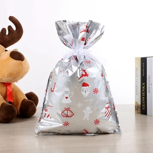Sac cadeau de Noël en aluminium argenté avec motifs Père Noël et cordon blanc