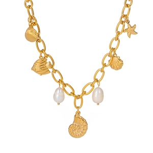Detailed close-up of gold ocean necklace with starfish, shells and pearls pendants