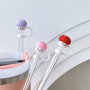 Detailed view of three cute silicone mushroom straw covers in purple, pink and red colors