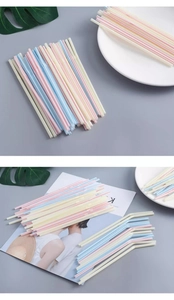 Macro detail of colorful striped flexible straws with bendable elbows for diverse beverages