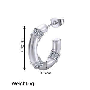 Detailed view of silver hoop earrings with pavé crystals showing dimensions 2.12cm and 5g weight