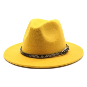 Detail of yellow wool fedora hat with a textured dark band and silver metal buckle