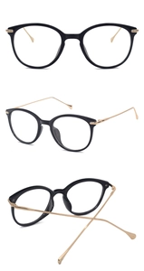 Detail view of black and gold cat-eye glasses frames showing front and side metal temples