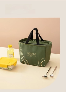Close-up of a large capacity dark green insulated lunch bag with durable handles