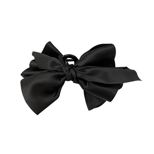 Elegant large black satin bow hair claw clip with a glossy finish for women's hairstyles