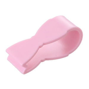 Pink bow-shaped quilt clips set of 6 for secure and needle-free bedding fastening