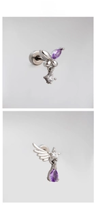 Detailed macro view of titanium steel earrings with purple zircon butterfly and stars