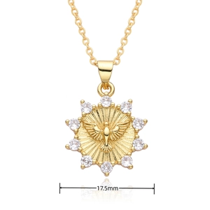 Detail view of 18k gold dove pendant with white zircon stones measuring 17.5mm wide