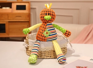 Detail of colorful patchwork duck plush toy with mixed textures in a cozy woven basket