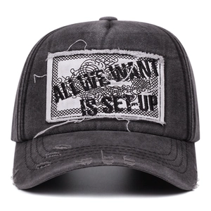 Vintage washed charcoal baseball cap featuring letter embroidery and distressed edges